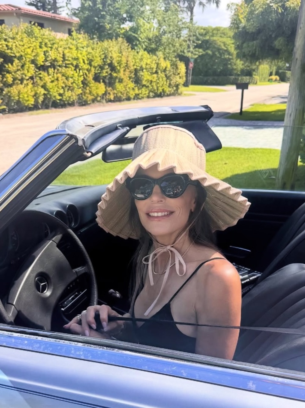 Packable Pleated Straw Sun Hat with Pink Polka Dot Trim - Picture 2 of 10